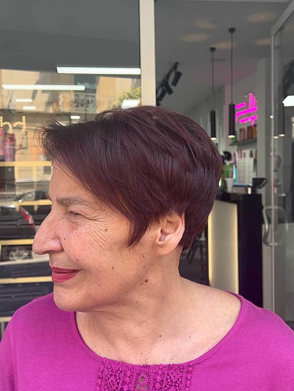 Deep plum sleek pixie with side-swept fringe