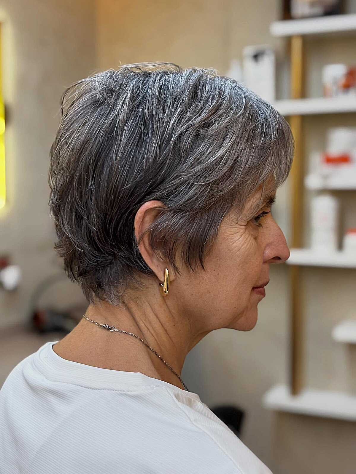 Layered feathered gray pixie from the back and side
