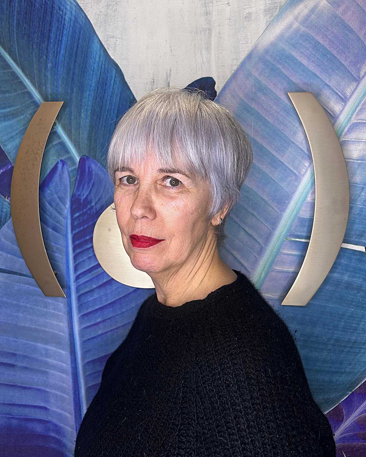 Lavender silver bowl-cut pixie with bold red lip