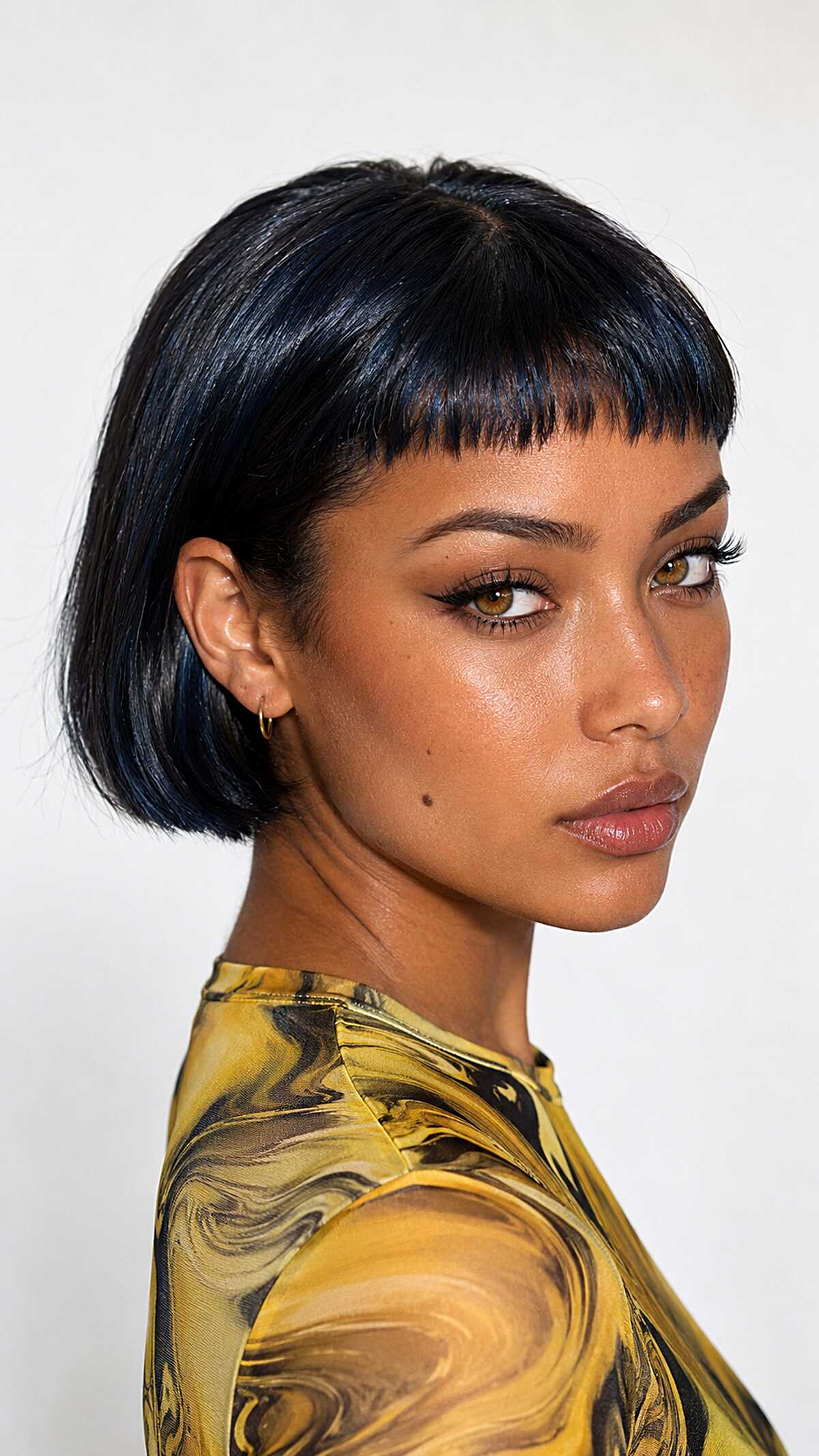 Sleek Black Ear-Length Bob with Sharp Micro Fringe