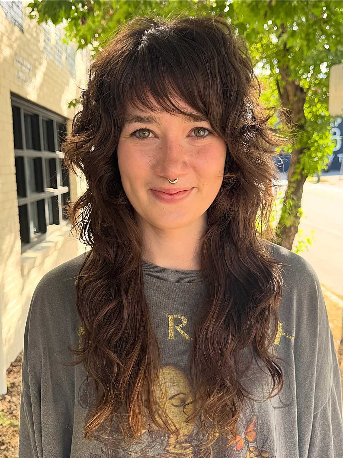 Long chocolate brown wavy shag with full bangs