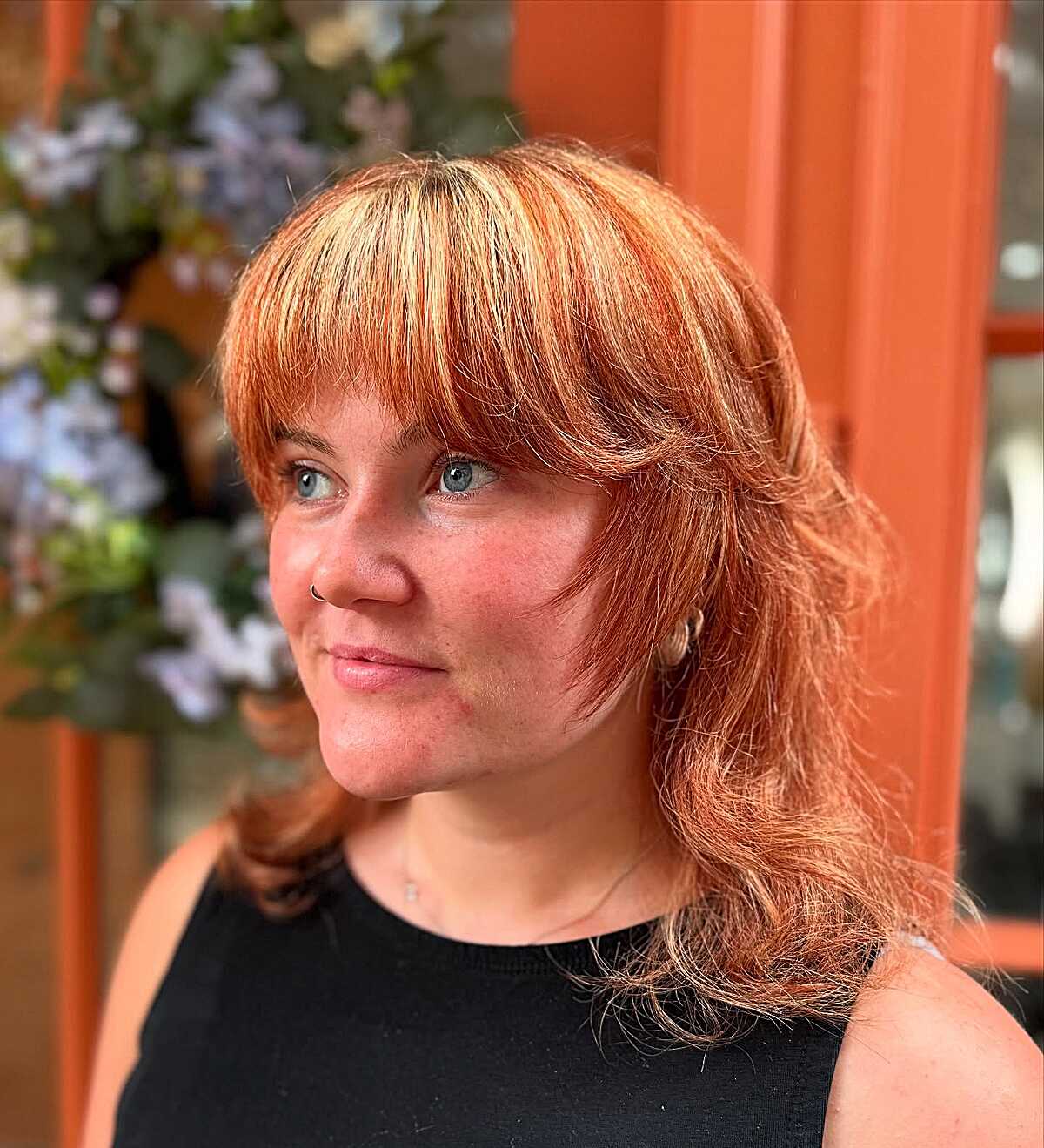 Medium copper red feathered shag with full bangs