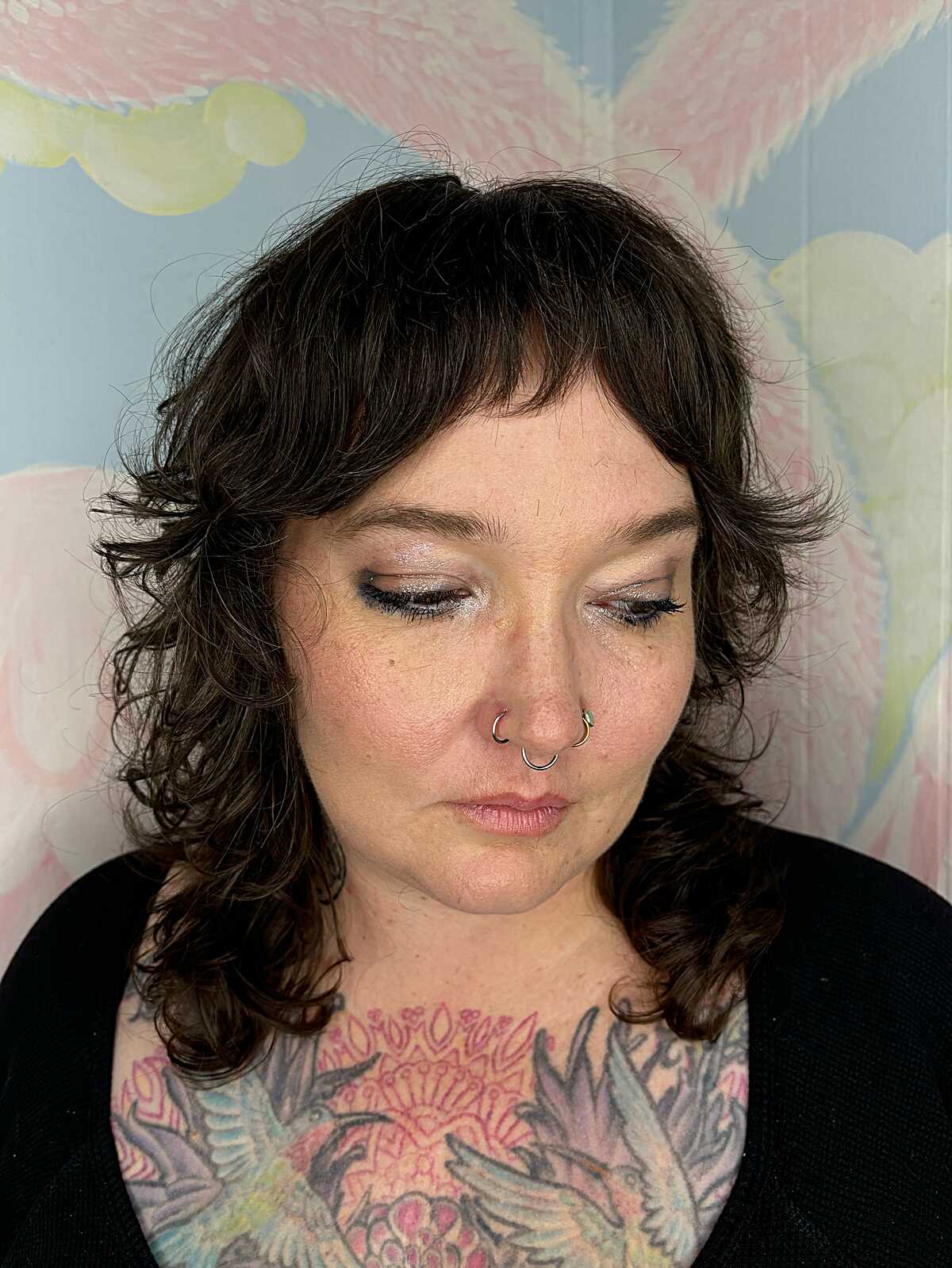 Curly dark brown feathered shag with short bangs