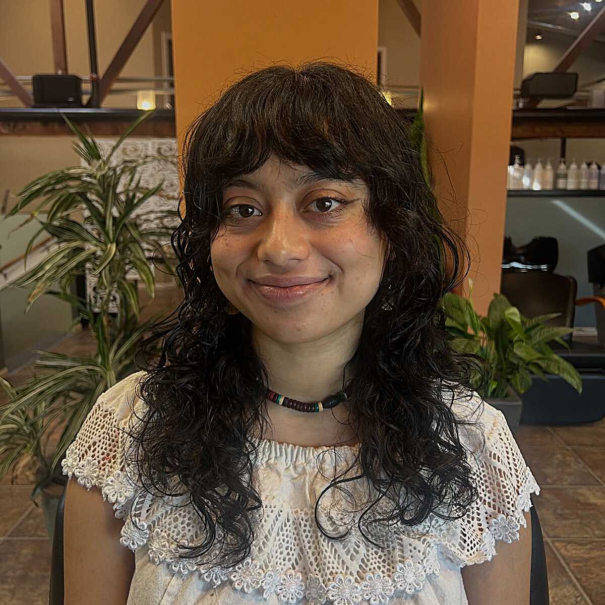 Long curly dark brown shag with layered bangs