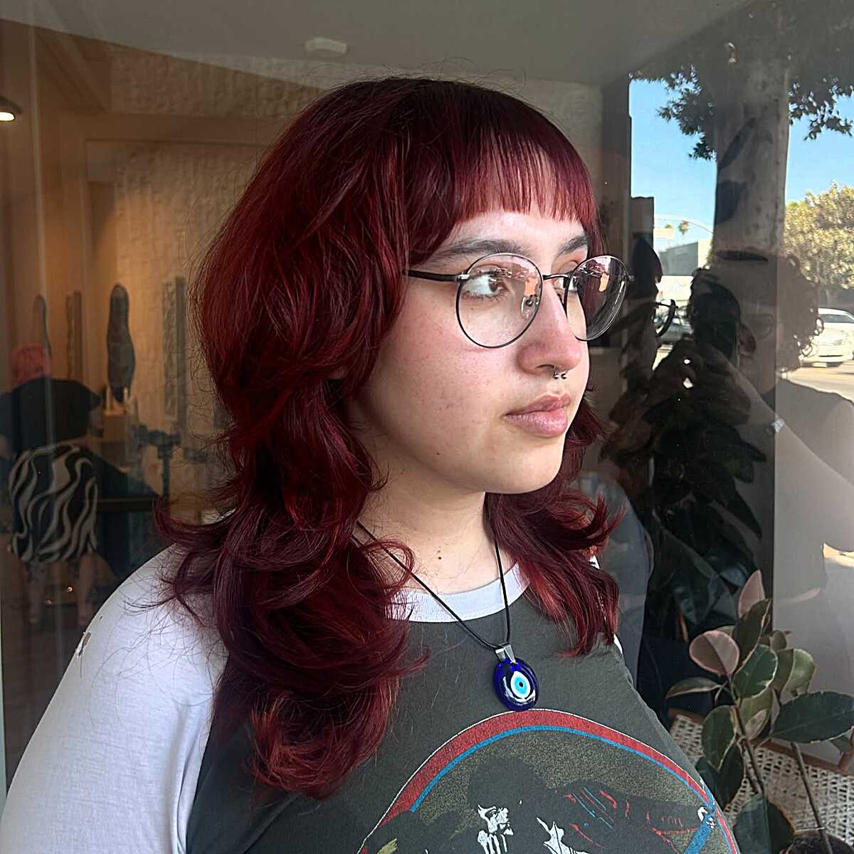 Deep cranberry red layered shag with short bangs