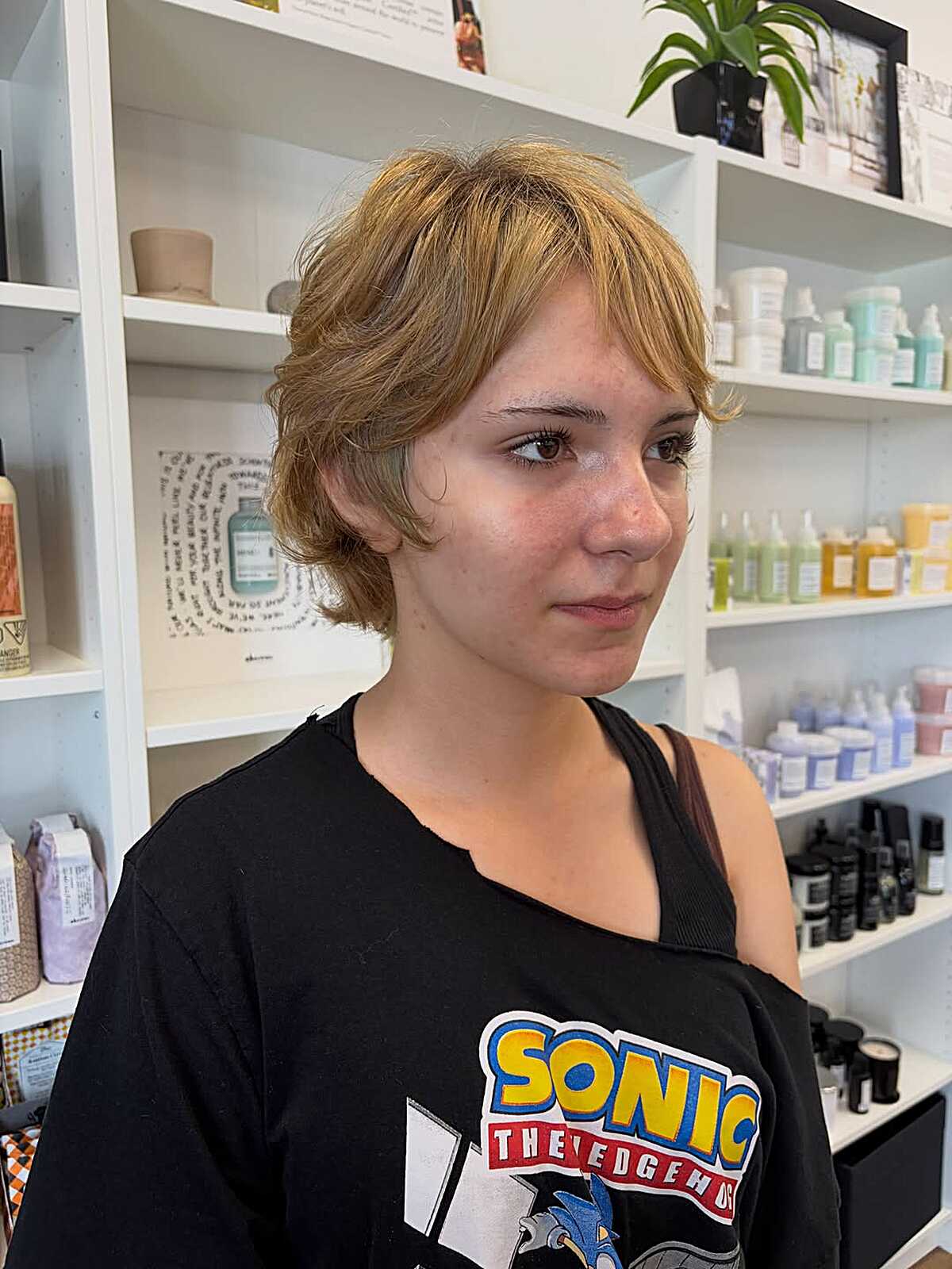 Short golden honey blonde shag with textured layers