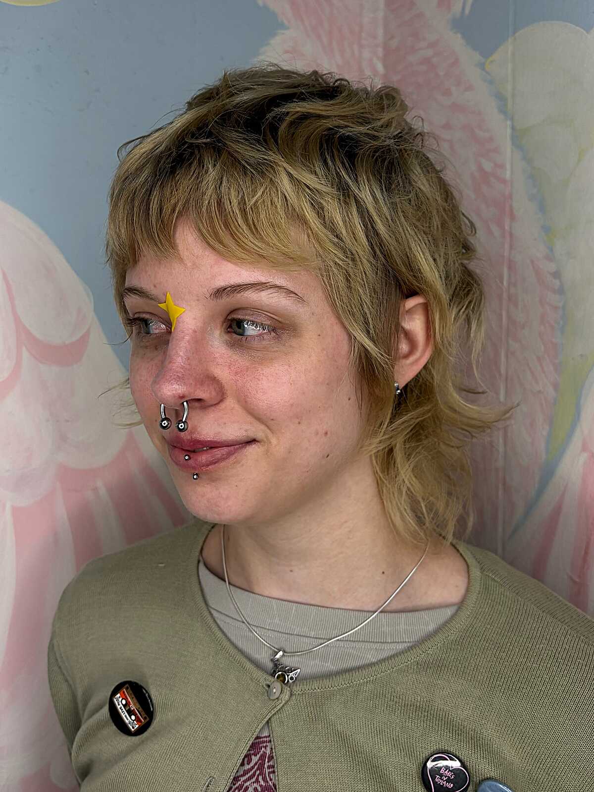 Short golden blonde feathered shag with micro bangs