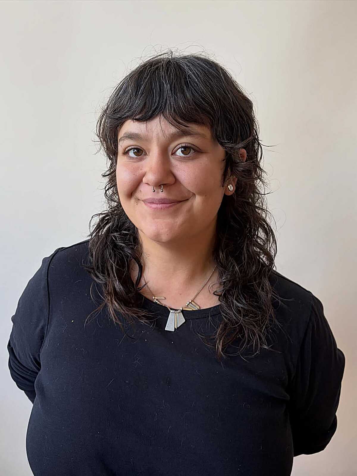 Long black curly feathered shag with straight bangs