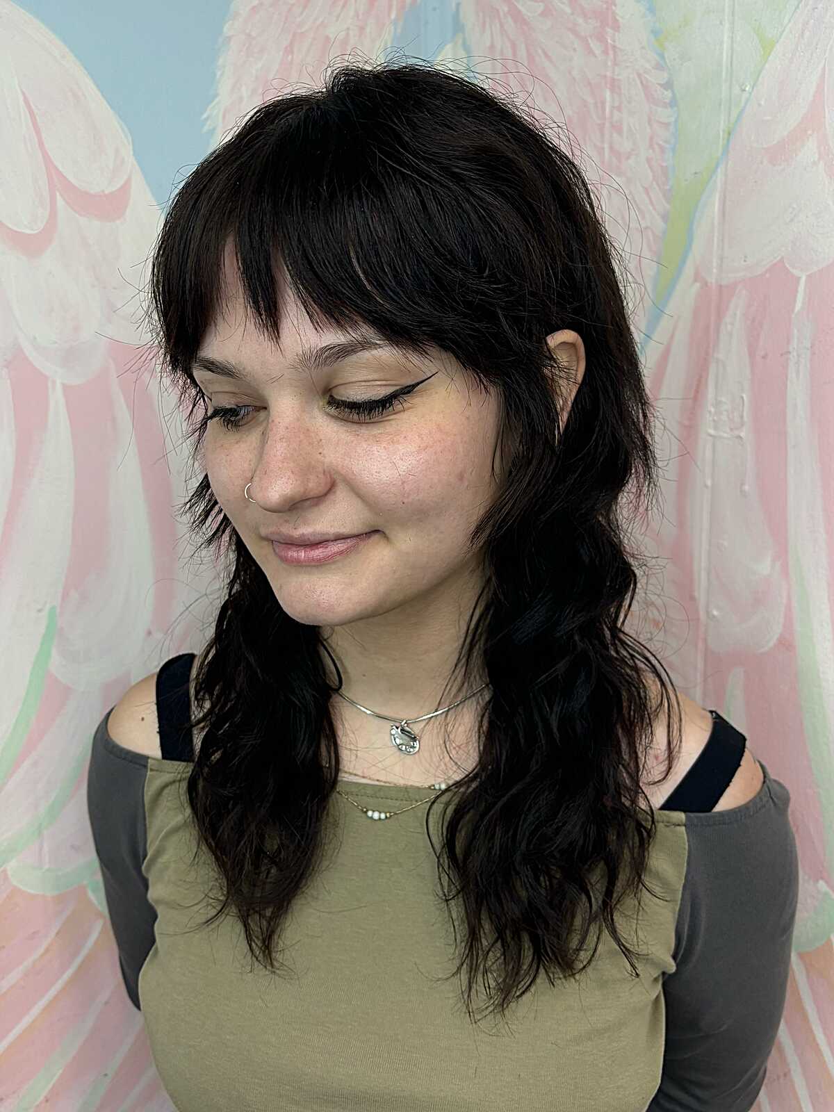 Long black wavy shag with bangs and face framing