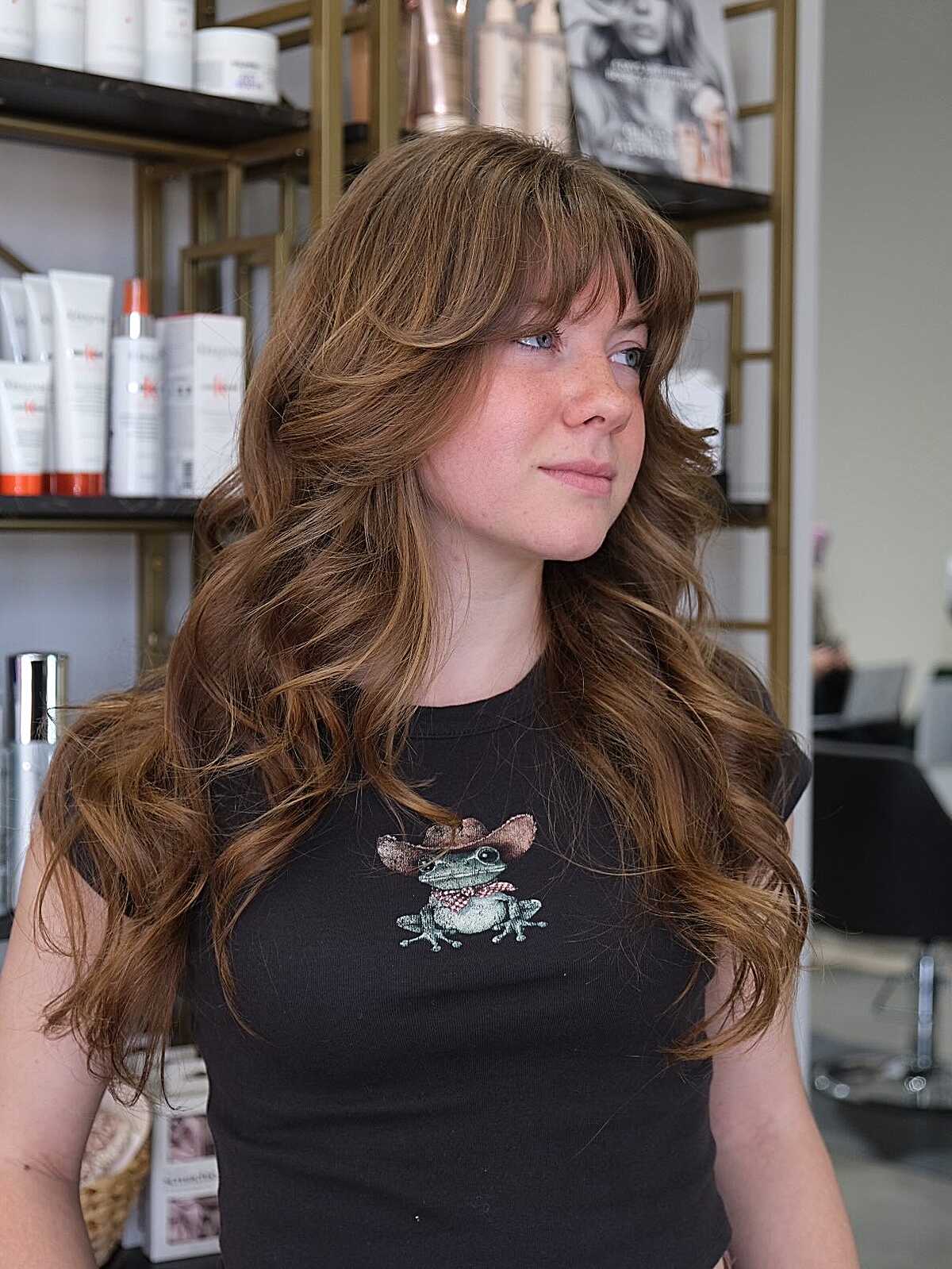 Long warm caramel shag with curled ends and bangs