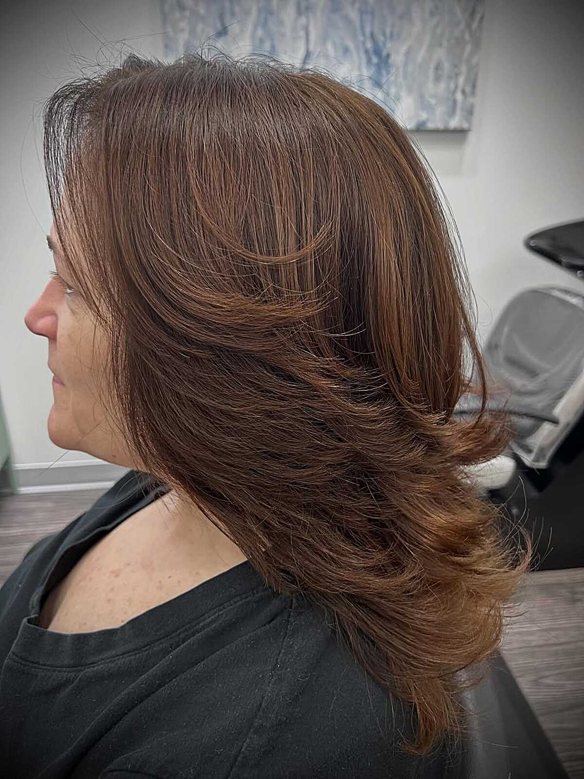 Medium-length feathered shag in warm chestnut brown