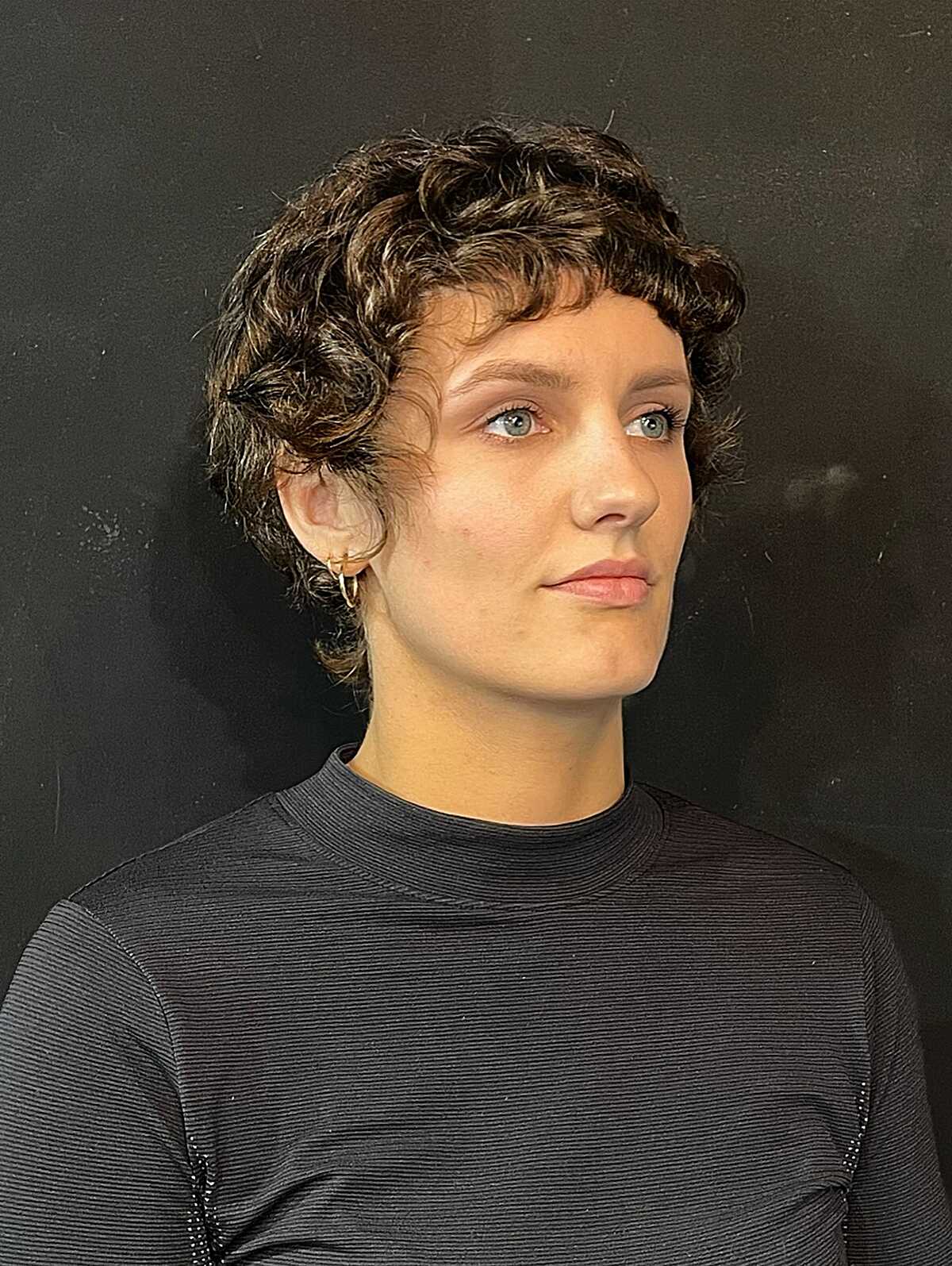 Curly Brunette Pixie Shag with Defined Ringlet Fringe and Tapered Ears