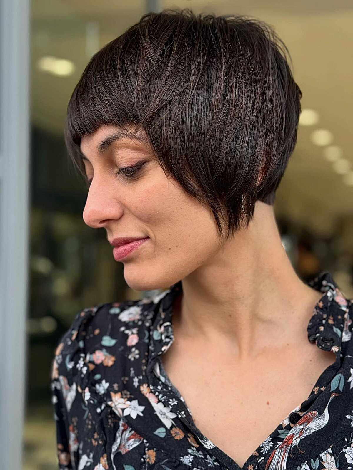 Dark Brunette Layered Pixie Shag with Blunt Micro Fringe and Tapered Neckline