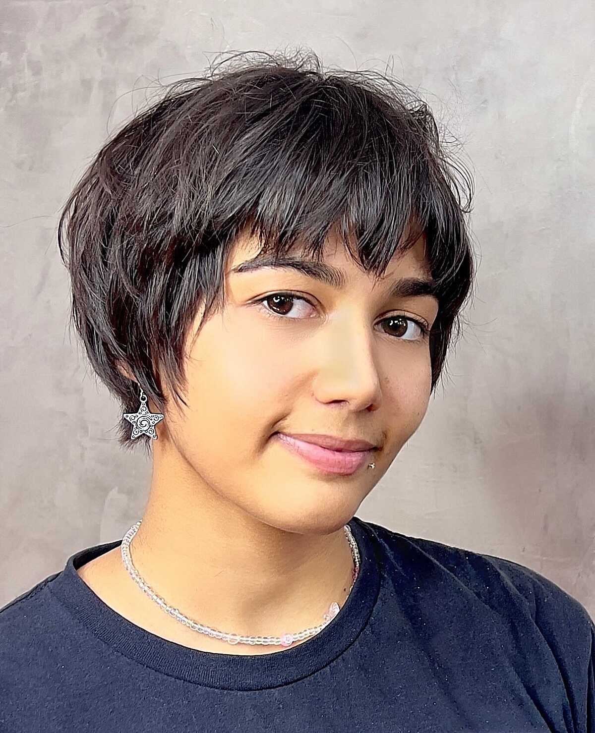 Ear-Length Dark Pixie Shag with Choppy Fringe and Textured Nape