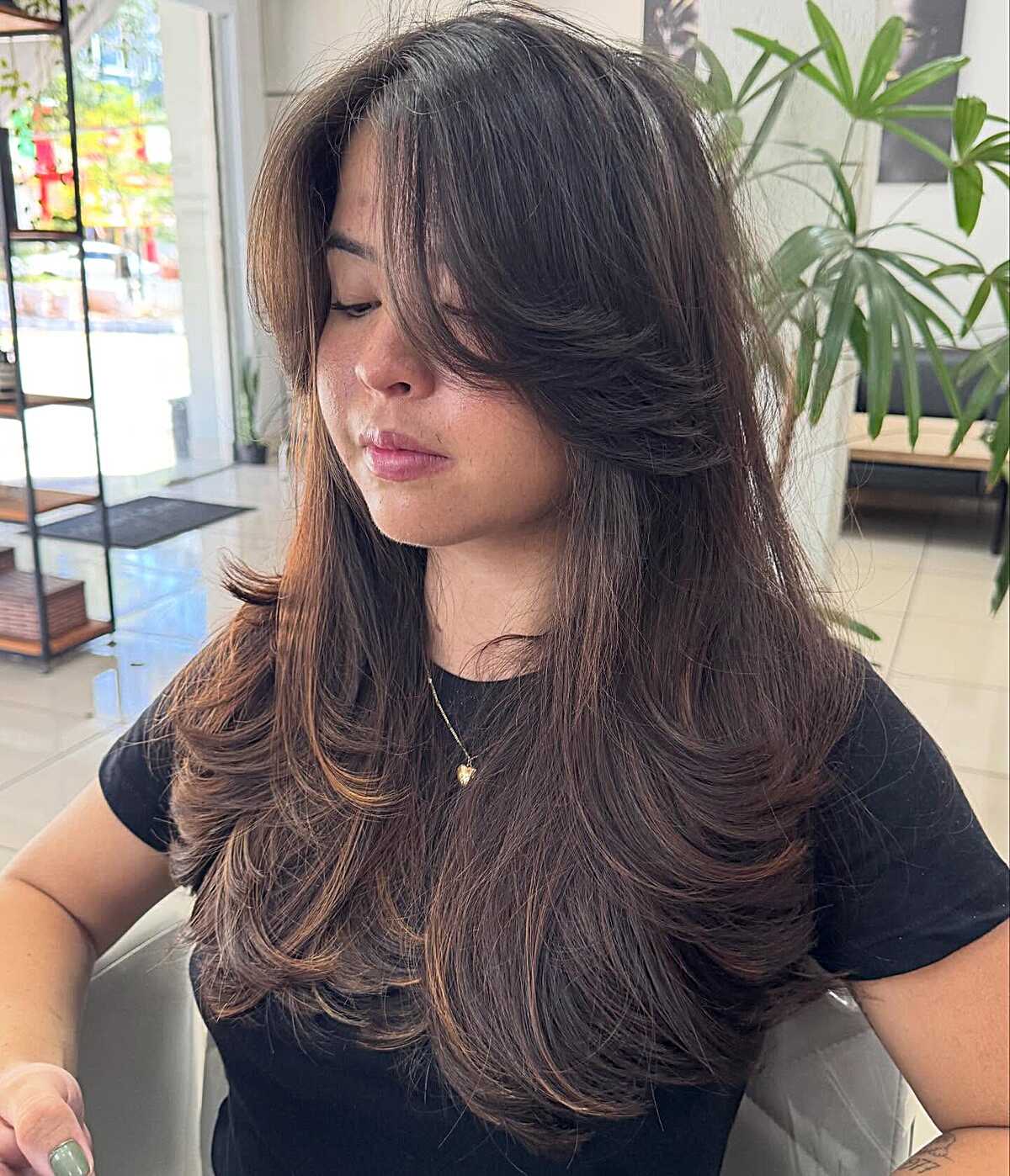 Dark Brunette Feathered Layers With Crown Lift and Swept Curtain Fringe