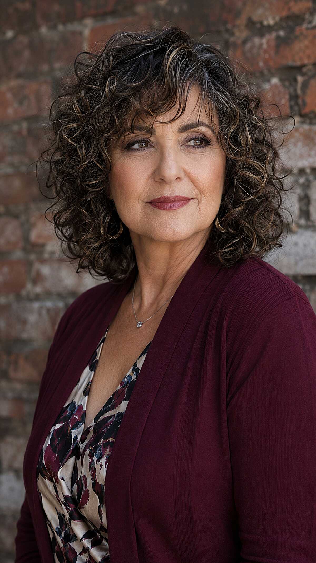 Dark Curly Bob with Honey Ribbon Highlights and Feathered Bangs
