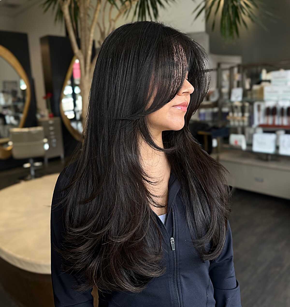 Jet Black Layers With a Heavy Fringe and Feathered Lower Half