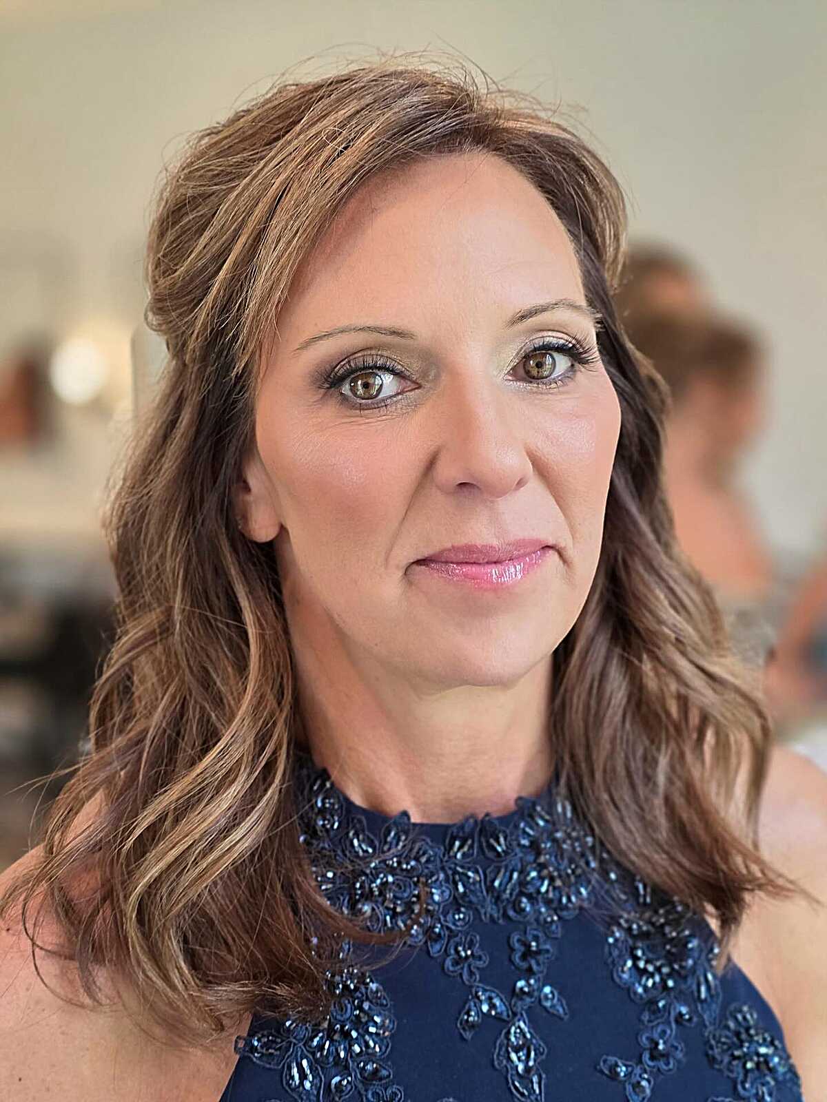 Soft Waves with a Deep Side Sweep on Bronde Hair