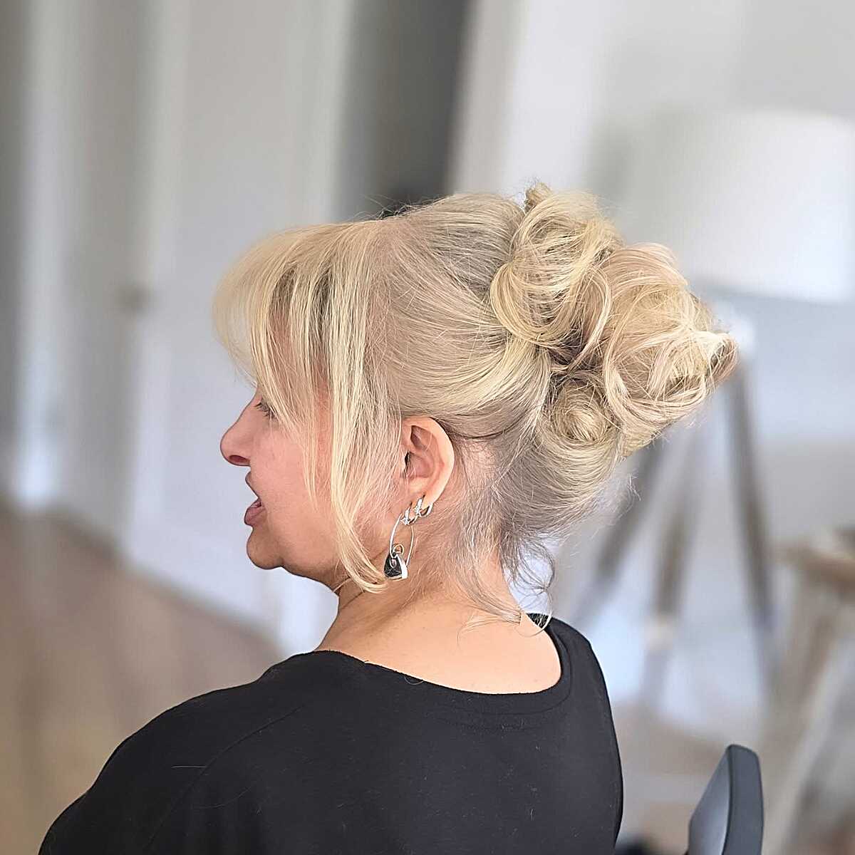 Textured Blonde Updo with Loose Face-Framing Pieces