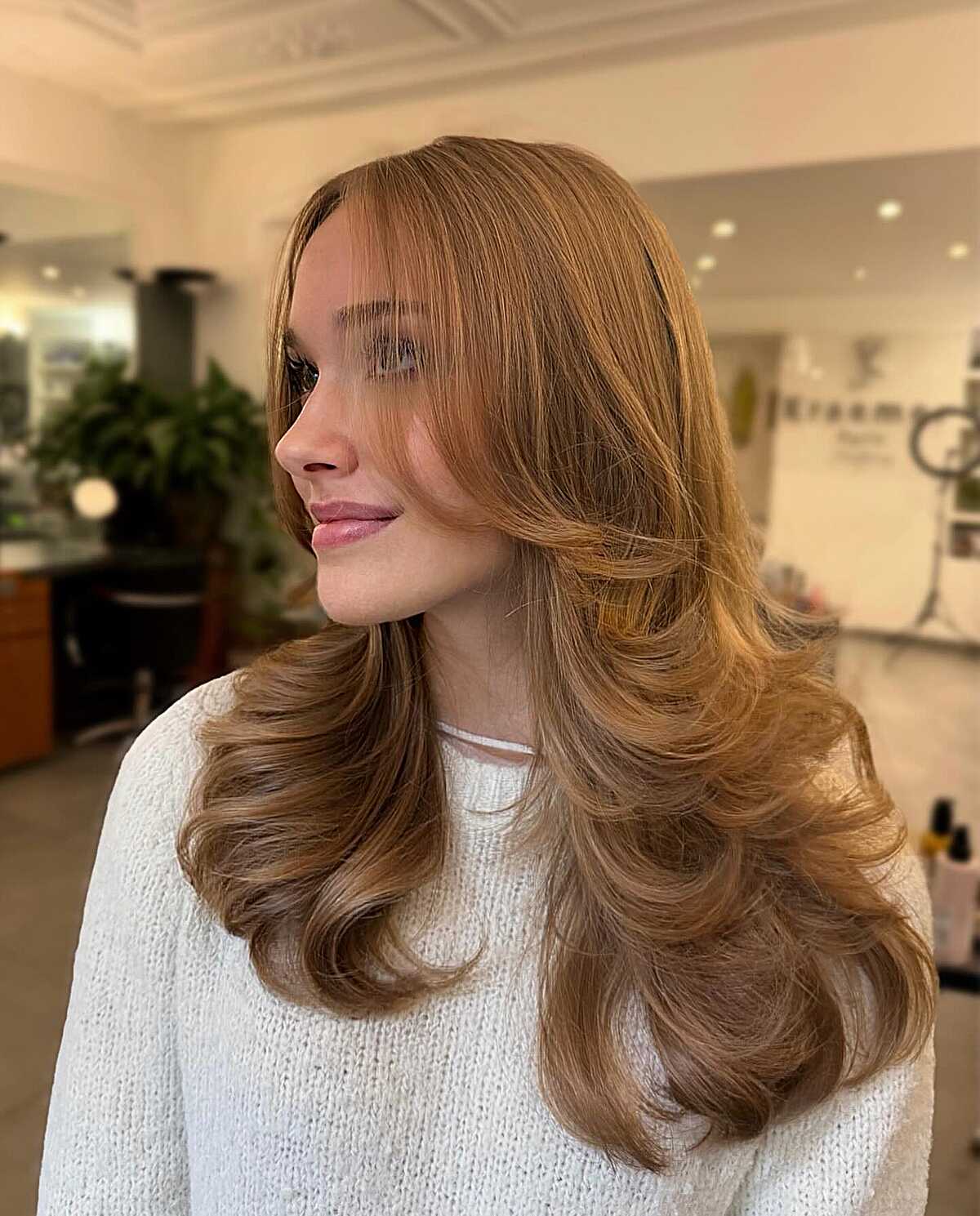 Warm Strawberry Blonde With Rolling Layers and a Round-Brush Finish