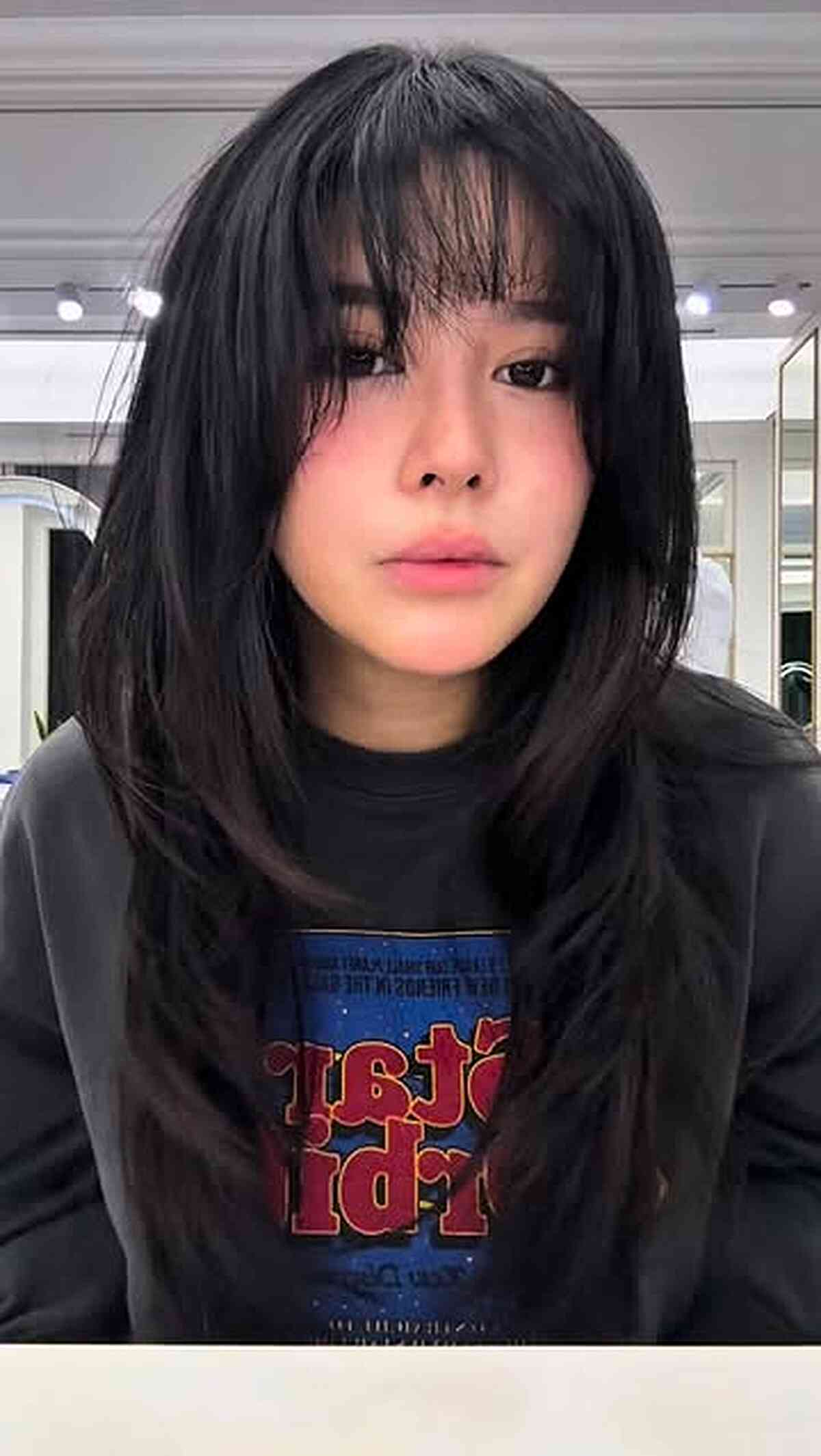 Modern Layered Cut with Wispy Curtain Bangs